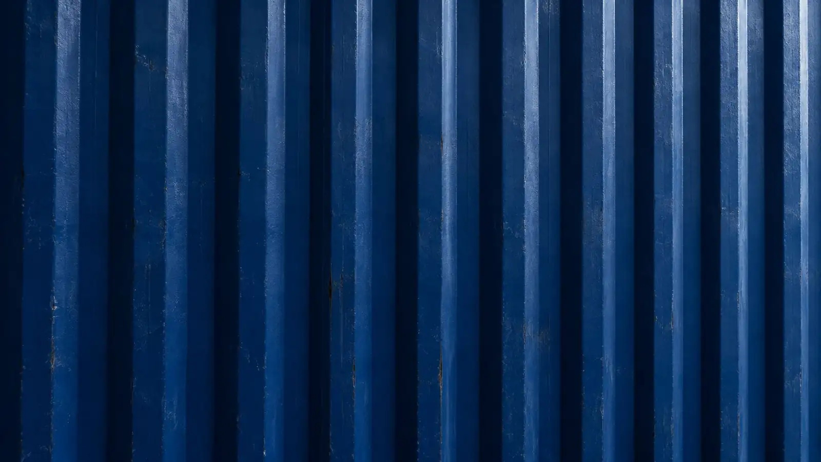 Close-up of blue corrugated shipping container steel
